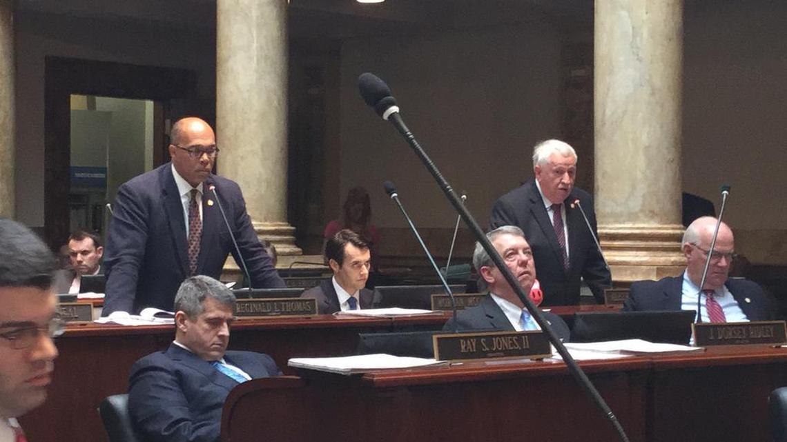 Sen. Reginald Thomas, D-Lexington, left, and Sen. Albert Robinson, R-London, debated a bill that would let businesses reject gay customers on religious grounds.