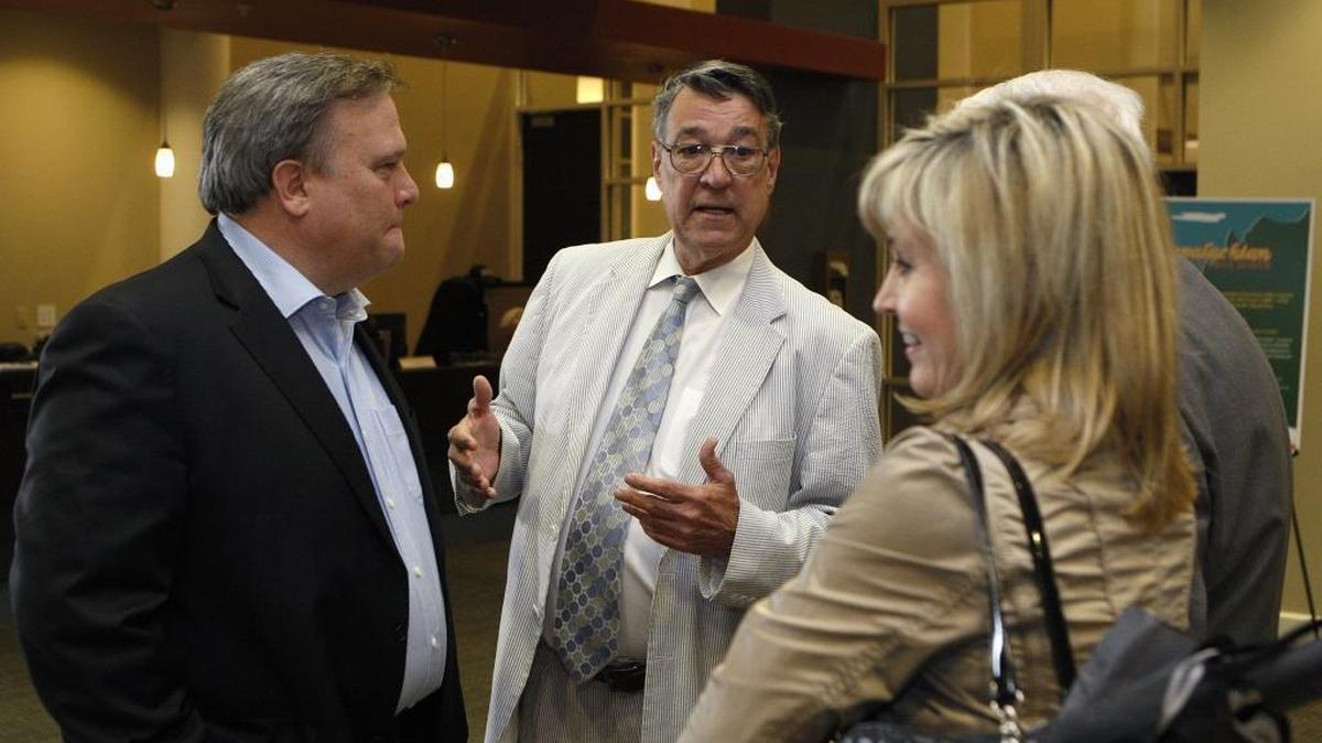 Then-Kentucky Supreme Court Justice Will T. Scott, who was running for governor, chats with Senate President Robert Stivers, left, and his wife Regina Stivers prior to a debate at Kentucky Community and Technical College System headquarters in Versailles, Ky., Weds., April 15, 2015.