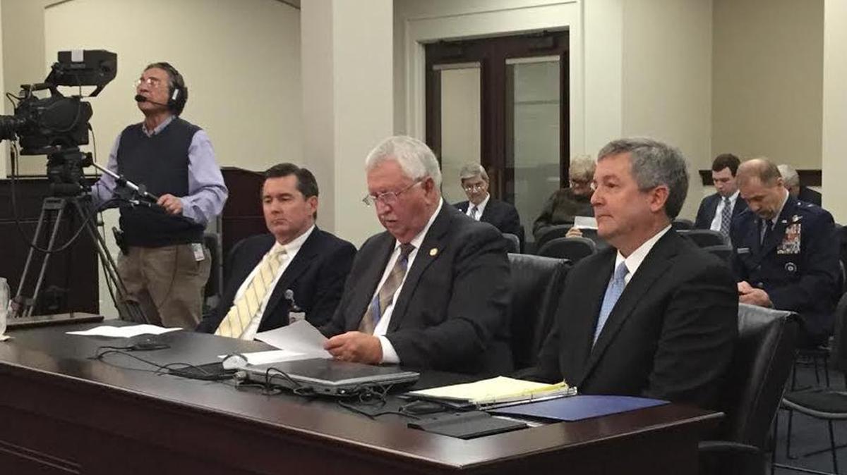 The Family Foundation of Kentucky’s Martin Cothran, left, and Stan Cave, right, flank state Sen. Albert Robinson, R-London, on Thursday while testifying for Senate Bill 180 in Frankfort.