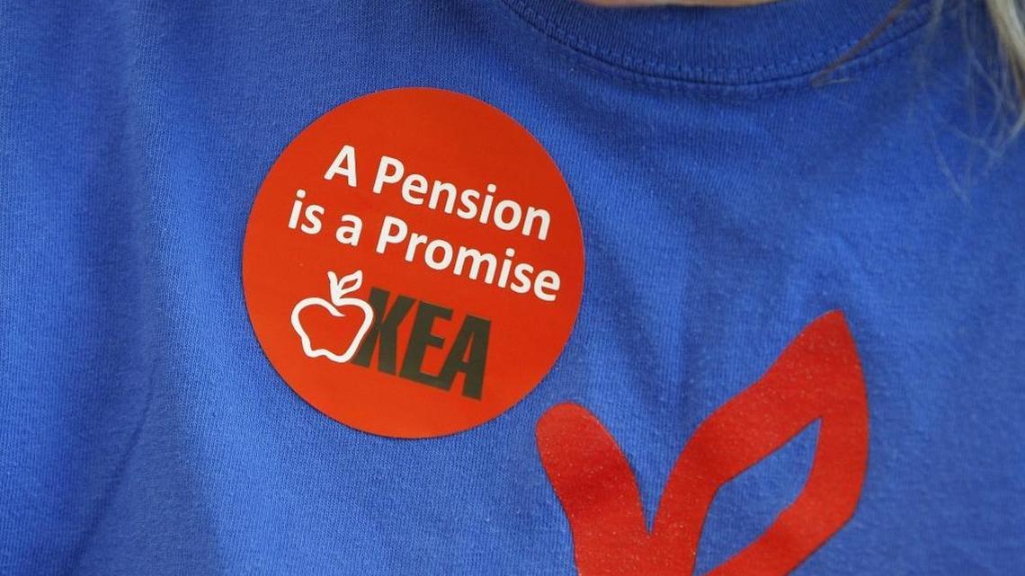 Sticker worn by educators during a town hall meeting about the state pension crisis in the cafeteria at Frederick Douglas High School in Lexington, Ky., Thursday, September 21, 2017.