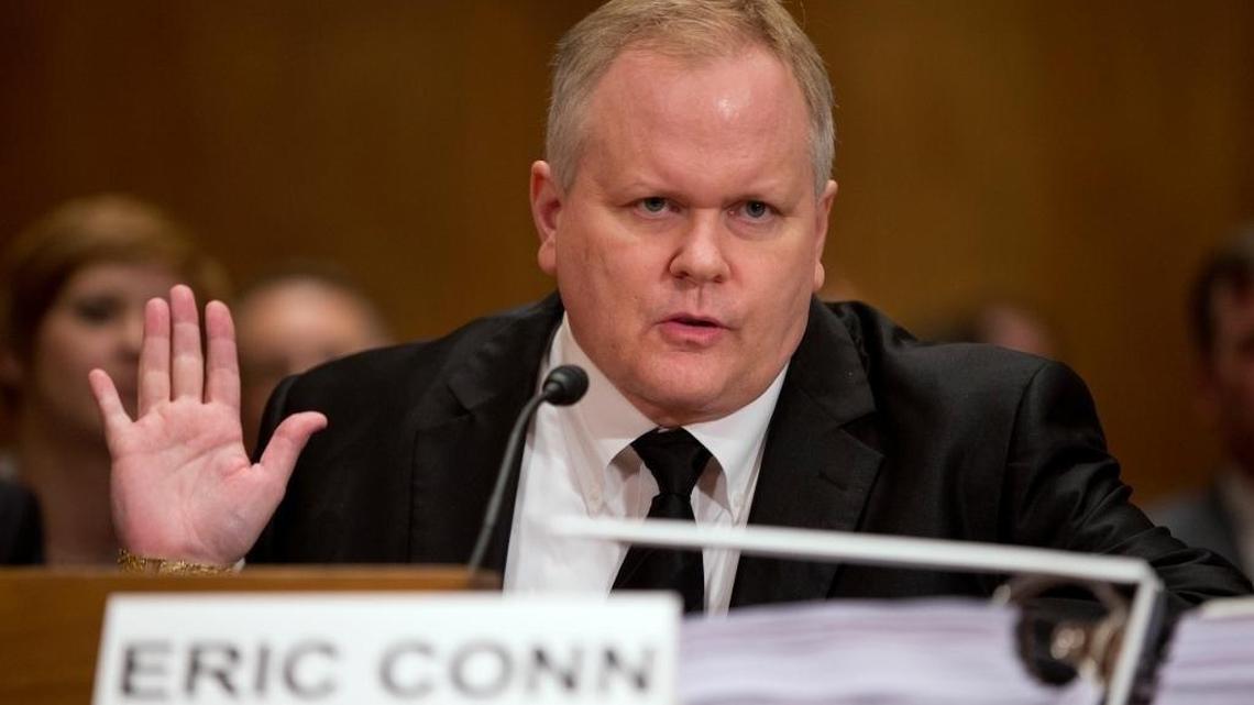 Attorney Eric Conn gestures as he invokes his Fifth Amendment rights against self-incrimination during a Senate Homeland Security and Governmental Affairs committee hearing on Capitol Hill on Monday, Oct. 7, 2013 in Washington. A report released by congressional investigators accuses Conn and retired Social Security judge David Daugherty of collaborating to improperly award disability benefits to hundreds of applicants from 2006 to 2010.