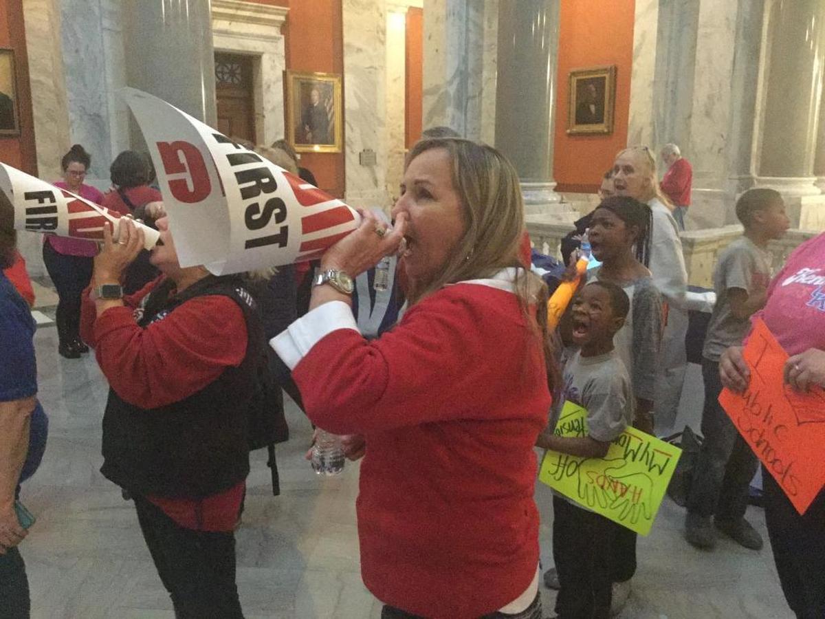 Retired teacher Claudette Green of Fayette County yells her protests against a surprise pension bill outside the House chamber in the Kentucky Capitol on March 29, 2018.
