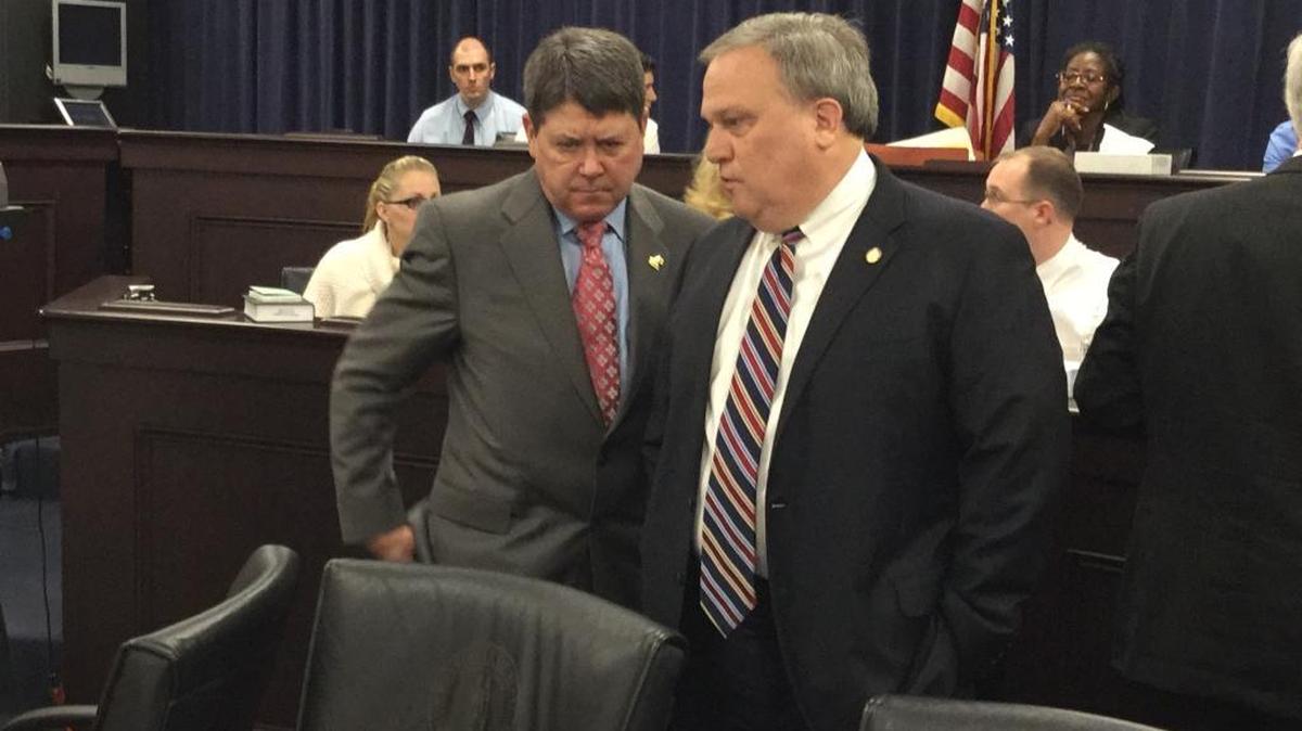 House Speaker Greg Stumbo, left, and Senate President Robert Stivers discuss a House proposal to end an impasse in state budget negotiations.