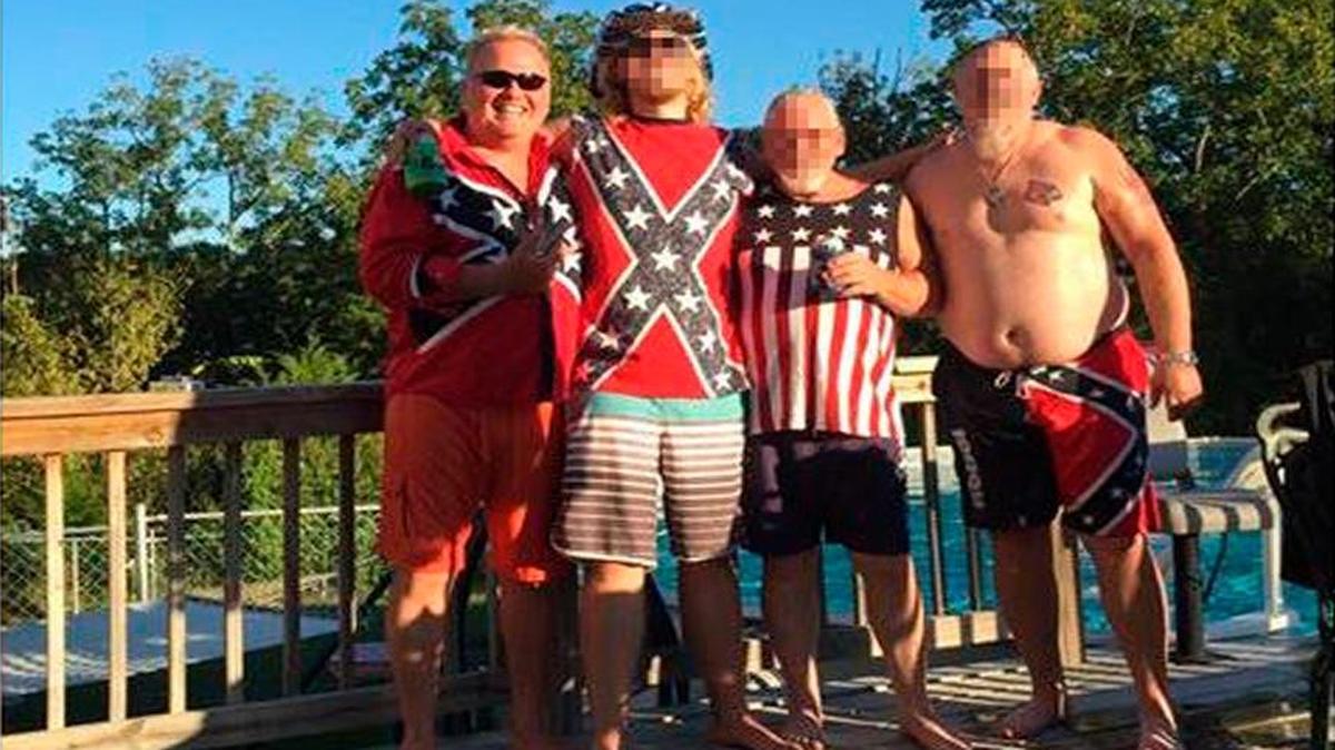 In this Facebook post, Dan Johnson, left, posed with friends wearing clothing with Confederate imagery.