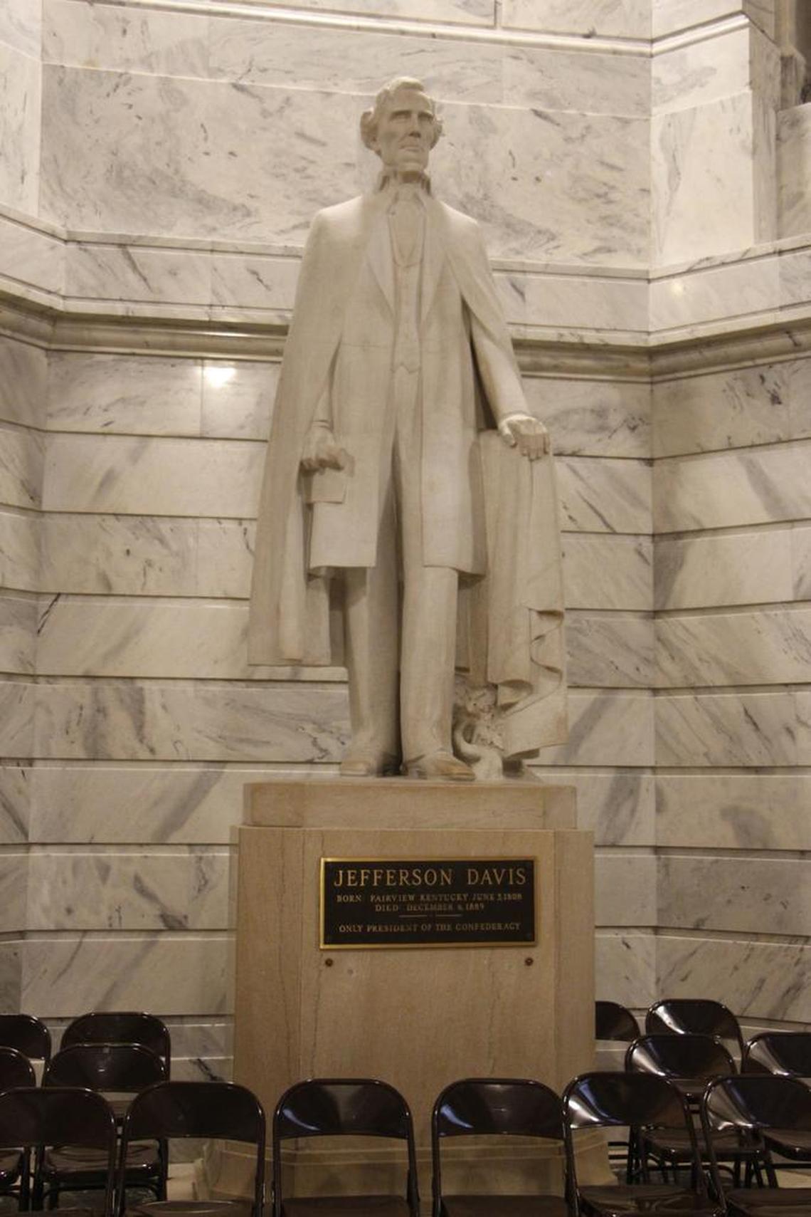 A controversial plaque on a statue of Jefferson Davis in the Kentucky Capitol Rotunda that described the president of the Confederacy as a “patriot-hero-statesman” was removed.