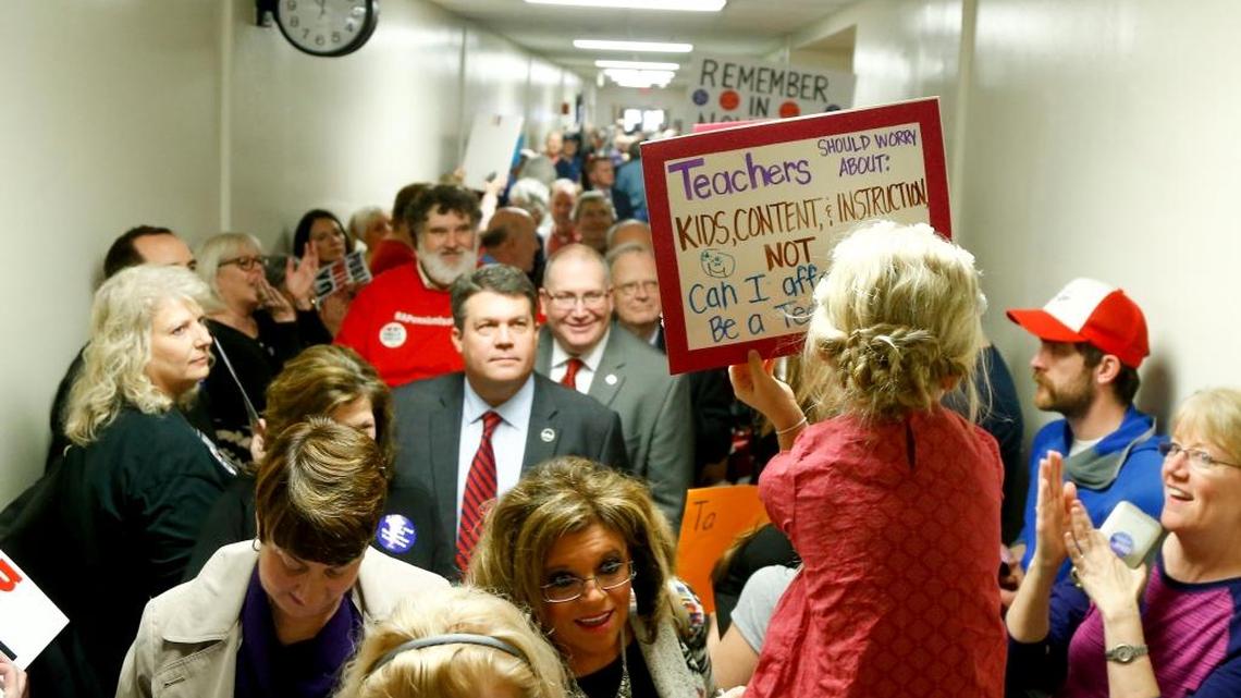 Retirees and teachers protest prior to a meeting of the Senate State and Local Government Committee to consider Senate Bill 1 at the Kentucky State Capitol Annex in Frankfort, Ky., on February 28, 2018.