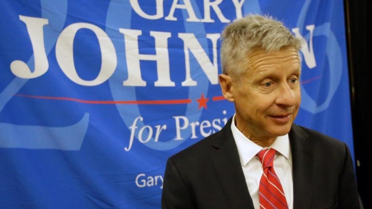 In this May 27, 2016 file photo, Libertarian presidential candidate Gary Johnson speaks to supporters and delegates at the National Libertarian Party Convention in Orlando, Fla.