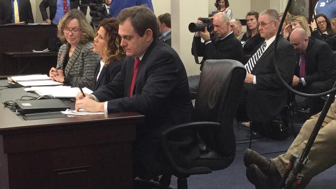 State alcoholic beverage officials — from left, distilled spirits administrator Trina Summers, malt beverage administrator Carol Beth Martin and general counsel Steve Humphress — testify Tuesday, Feb. 13, 2018, against a bill that keep the state’s current liquor license quota system in place. The sponsor of the bill, Senate President Pro Tem Jimmy Higdon, R-Lebanon, with glasses behind them, listens as they speak.
