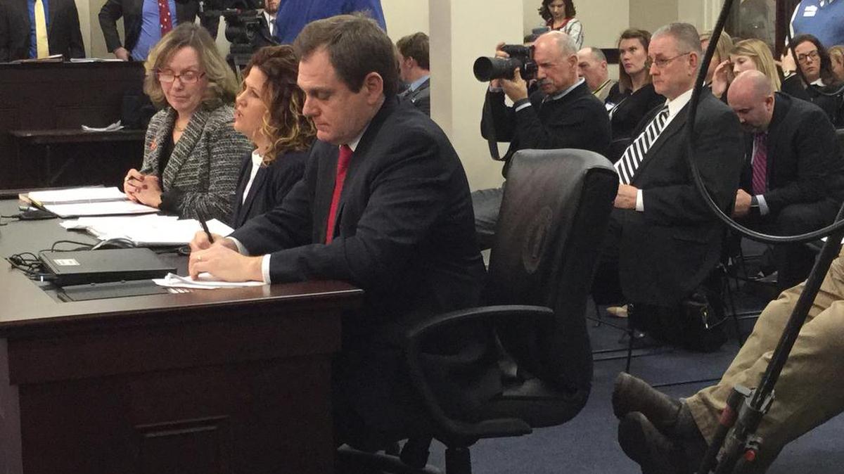State alcoholic beverage officials — from left, distilled spirits administrator Trina Summers, malt beverage administrator Carol Beth Martin and general counsel Steve Humphress — testify Tuesday, Feb. 13, 2018, against a bill that keep the state’s current liquor license quota system in place. The sponsor of the bill, Senate President Pro Tem Jimmy Higdon, R-Lebanon, with glasses behind them, listens as they speak.