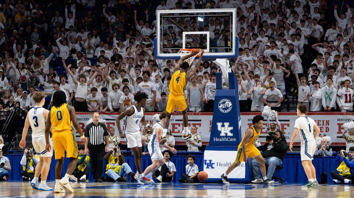 Jaws drop, and fans go wild after St. Xavier's Jordan Jackson slam dunks the ball during the UK HealthCare Boys' Basketball Sweet 16 state tournament first-round game between Covington Catholic and St. Xavier at Rupp Arena on March 18, 2026.