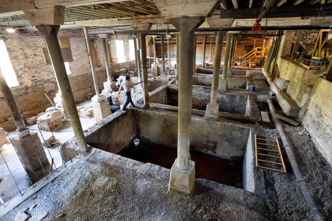 Bourbon archaeologist Nick Laracuente walked along an unearthed fermentation tank in 2016 at the remains of an old distillery found inside the floor of a building at the Buffalo Trace Distillery. The site will be preserved for future tours as a kind of “bourbon Pompeii,” Laracuente said.