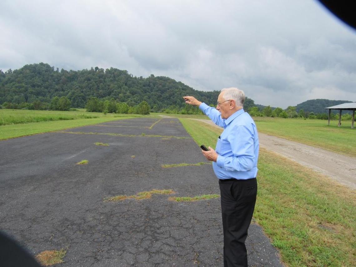 Elwood Cornett, a retired educator who has helped lead the the effort to have the federal government build a high-security prison in Letcher County, shows the preferred site for the prison, on a spot flattened by surface mining at Roxana. 8/6/2015