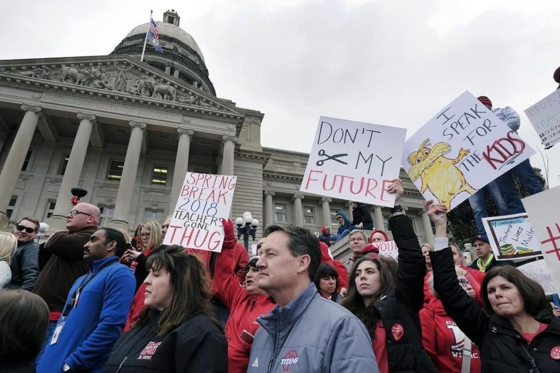 Thousands of public school teachers, employees and their supporters from across Kentucky rallied at the state Capitol to protest pension benefit cuts and advocate for more money for education.