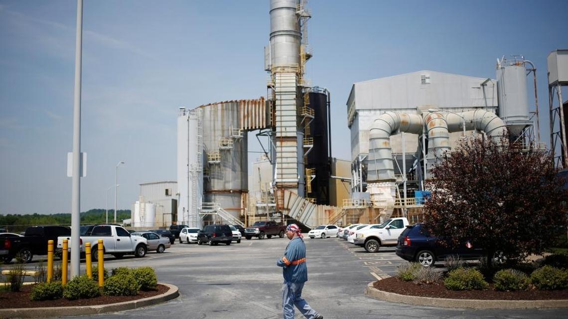 A plant employee walked through the parking lot outside Century Aluminum’s smelter.