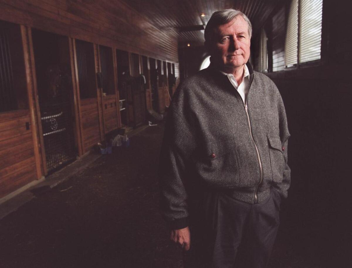 Don Ball, stands in the training barn Feb. 1, 2000 where some scenes from “Simpatico” were filmed at his Donamire Farm.