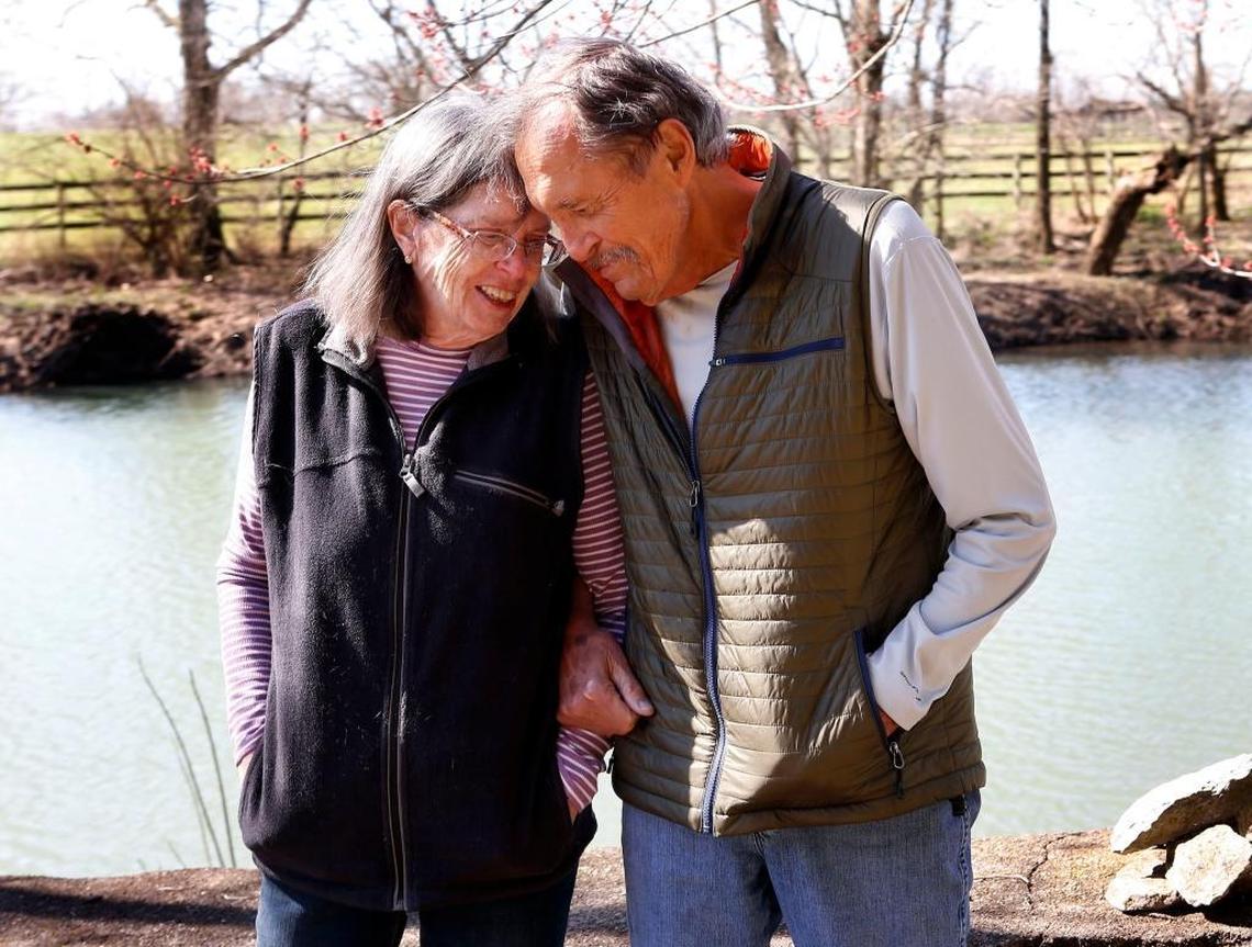 Kentucky photographer James Archambeault hugged his wife, Lee, next to the Elkhorn Creek behind their house in Scott County. Archambeault is known for his numerous photography books and calendars about his state.