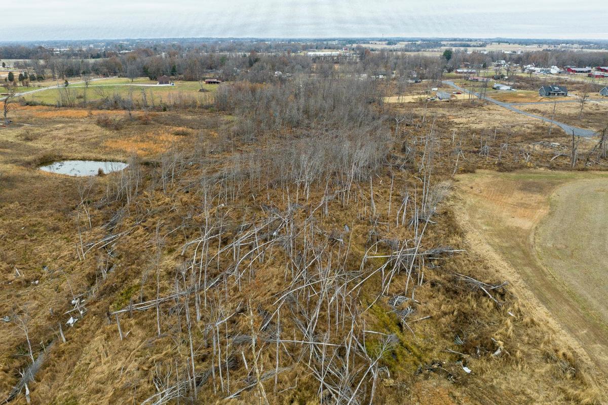 The path of a tornado that struck near Bremen, Ky., is still visible nearly a year after the tornado hit. Monday, Dec. 5, 2022.