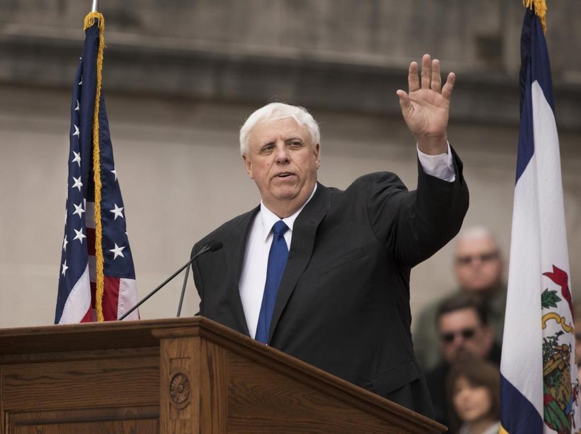 West Virginia Gov. Jim Justice waves to the crowd as he delivers his inauguration speech, Monday, Jan. 16, 2017, in Charleston, W.Va.