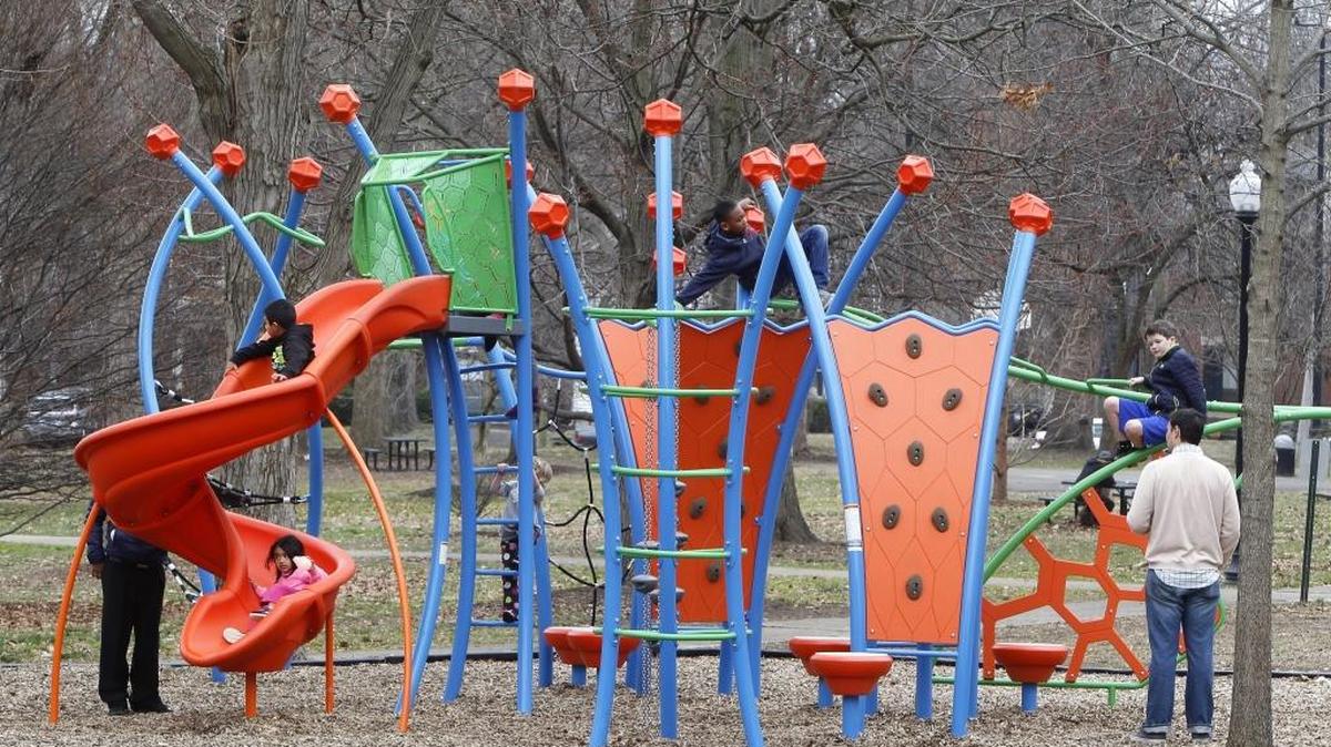 Kids enjoyed the playground at Woodland Park as above average temperatures continued Sunday in Lexington.
