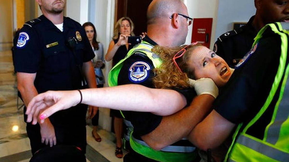 Stephanie Woodward, of Rochester, N.Y., who has spina bifida and uses a wheelchair, was removed from a sit-in outside Senate Majority Leader Mitch McConnell's office in Washington last week as she and other disability-rights advocates protested proposed caps on Medicaid.