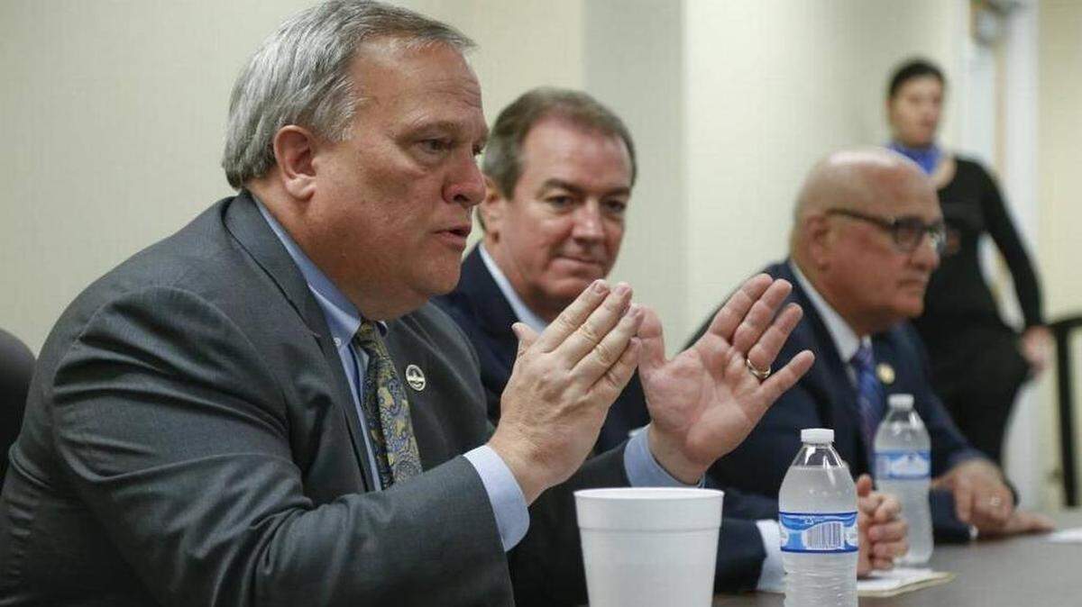 Kentucky Senate President Robert Stivers, left, and House Speaker Pro Tem David Osborne, center, with Sen. Joe Bowen during the 2018 legislative session.