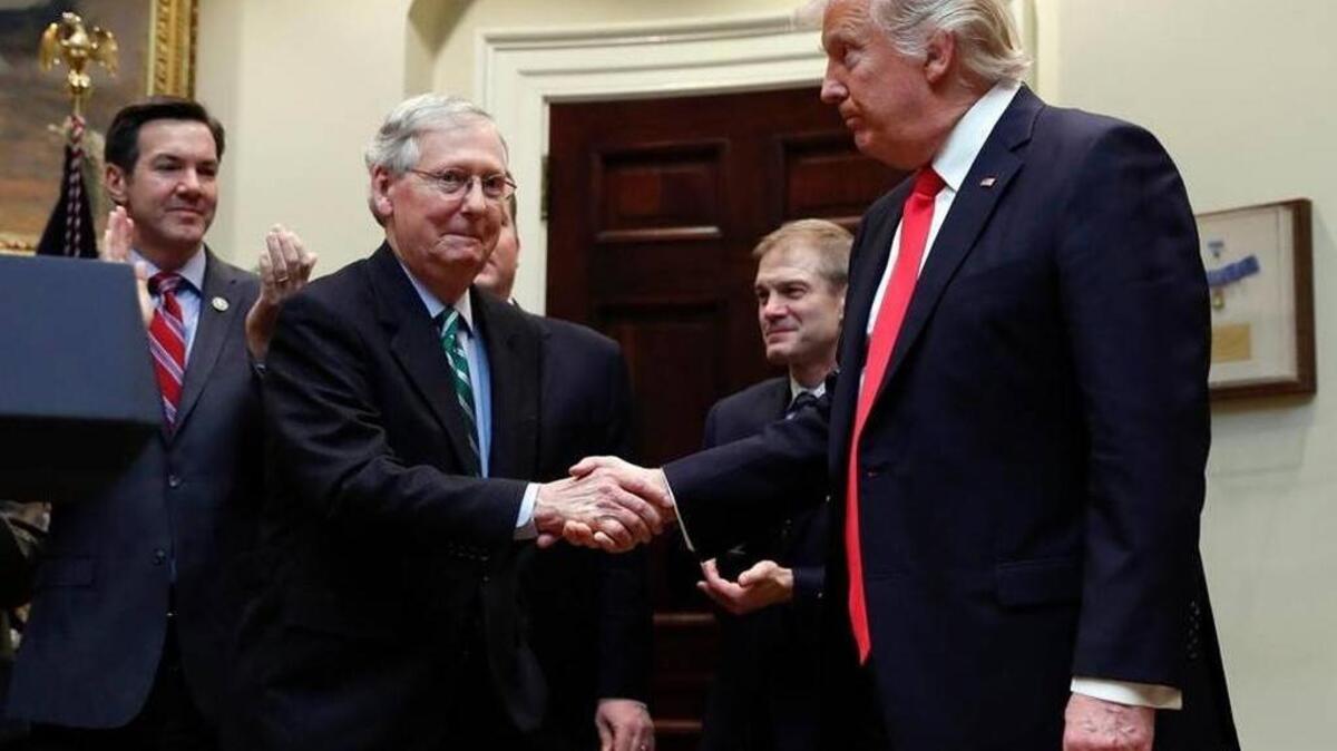 Senate Majority Leader Mitch McConnell and President Donald Trump congratulated each other at a White House ceremony in February.