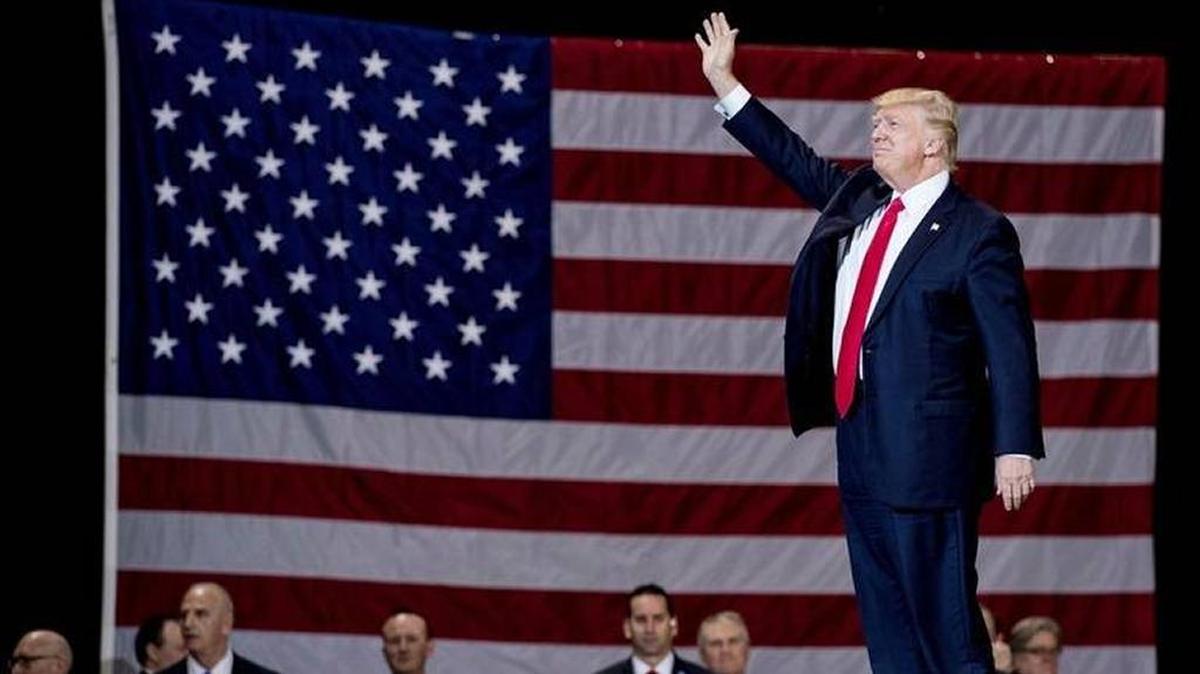 President Donald Trump arrives to speak at a rally at the Kentucky Exposition Center in Louisville March 20.