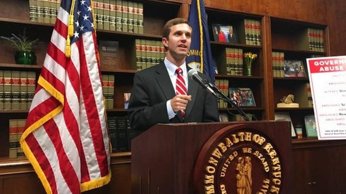 Attorney General Andy Beshear speaks to reporters Wednesday about his objections to Gov. Matt Bevin’s unilateral rewrite of laws governing a number of education boards.