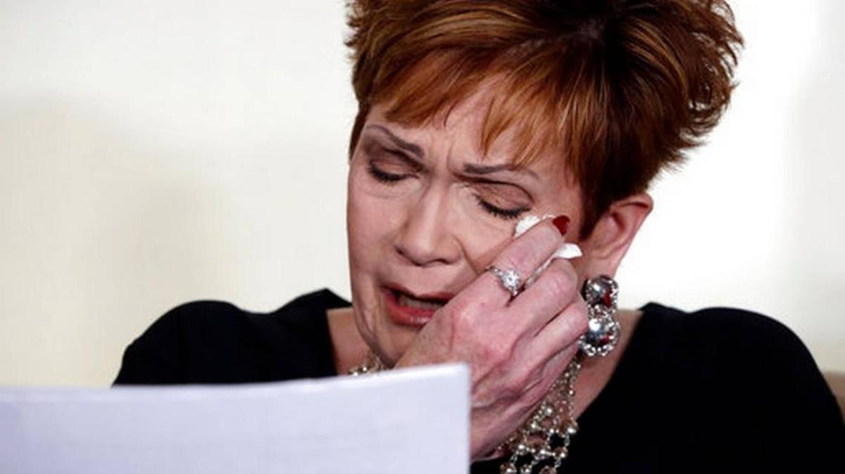 Beverly Young Nelson, the latest accuser of Alabama Republican Roy Moore, reads her statement at a news conference, in New York, Nov. 13, 2017. Nelson says Moore assaulted her when she was 16 after he offered her a ride home from a restaurant where she worked. Moore says the latest allegations against him are a “witch hunt.”