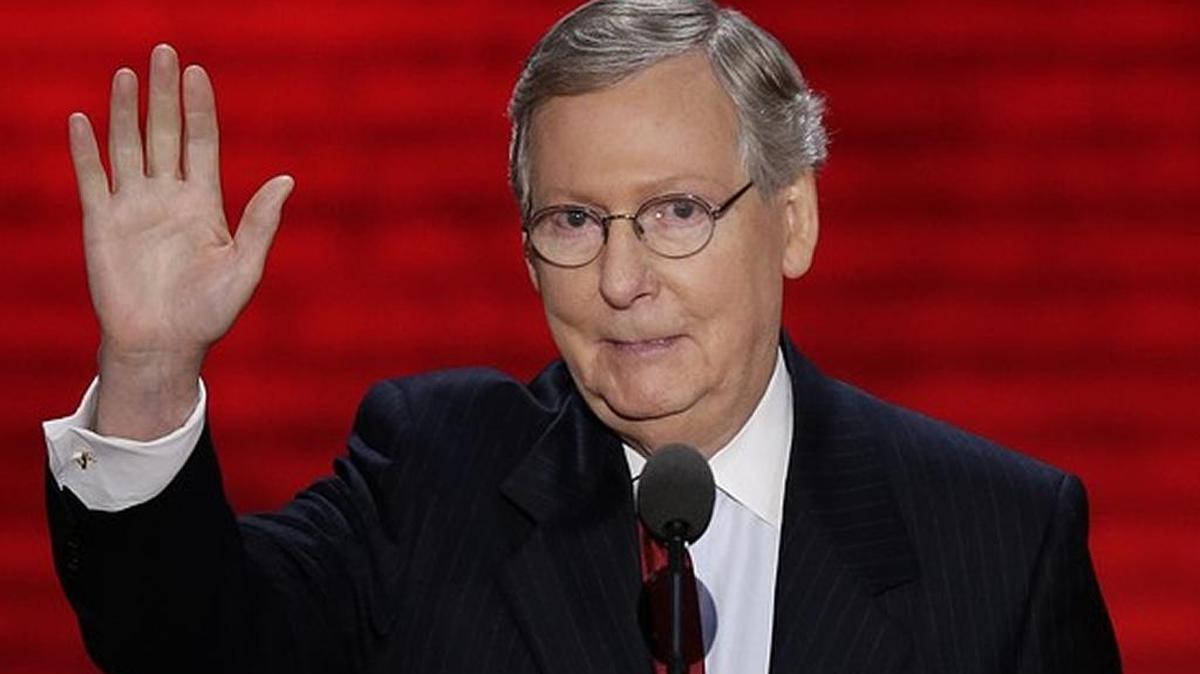 Sen. Mitch McConnell waves to delegates after addressing GOP convention.