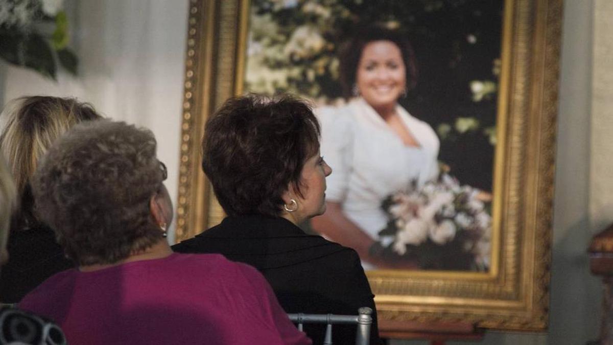 Diana Ross, right, sat in front of her daughter’s portrait at Amanda Ross’s 2009 funeral. Former state lawmaker Steve Nunn pleaded guilty to her murder. Ross successfully advocated for a law for GPS monitoring of those who violate protective orders.