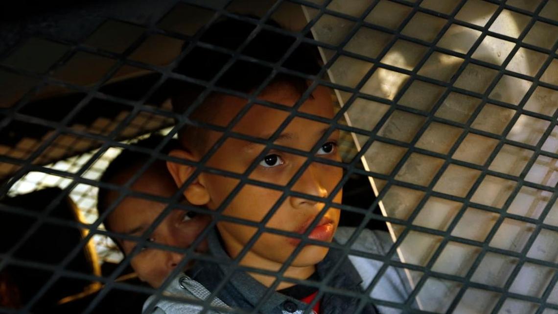A young boy in a van headed for a detention center in Texas