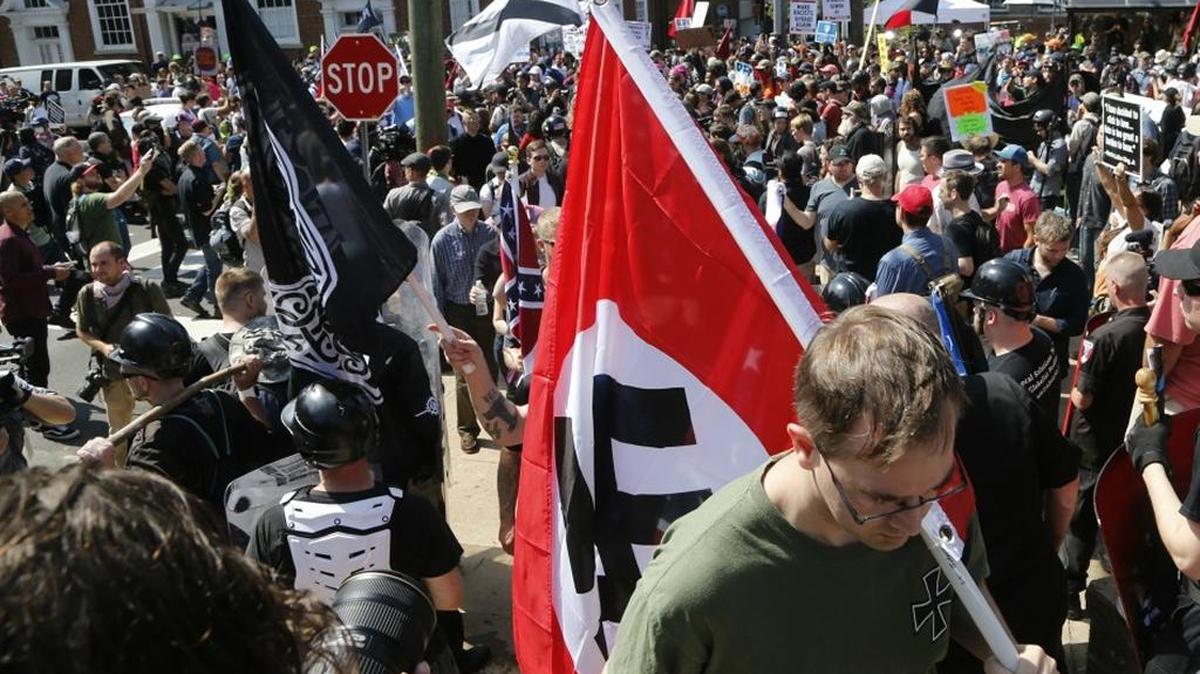 A white supremacist carried a Nazi flag during a protest in Charlottesville, Va.