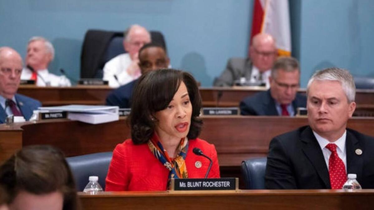 U.S. Rep. James Comer, R-Kentucky, right, listens as Rep. Lisa Blunt Rochester, D-Del., argues against the Republican-backed farm bill during a meeting of the House Agriculture Committee.