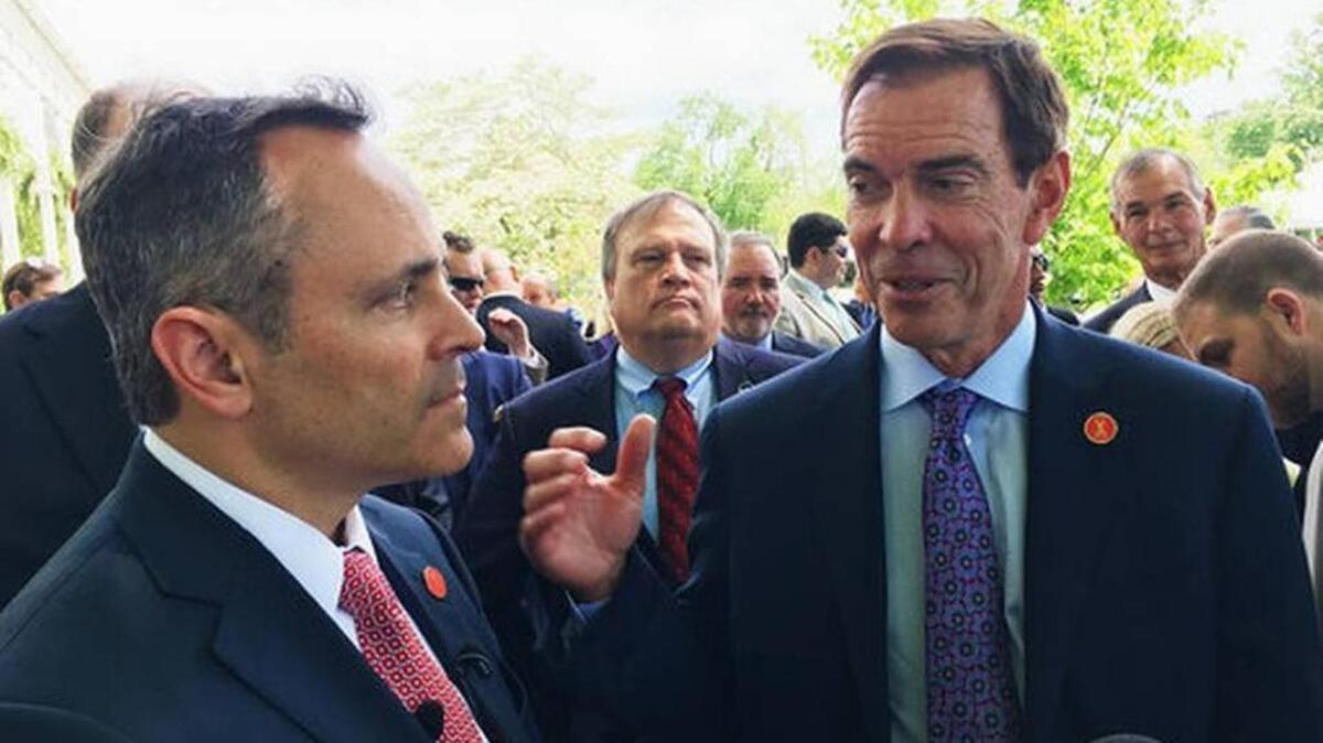 Braidy Industries Inc. CEO Craig Bouchard, right, and Republican Gov. Matt Bevin speak with reporters in Wurtland. The aluminum company says it will spend $1.3 billion to build an aluminum plant in Greenup County, pledging to hire 550 people.