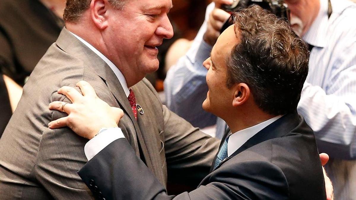 Rep. Jeff Hoover left, embraced Ky. Gov. Matt Bevin before Hoover was sworn in as Speaker of the House of Representatives in January. Hoover took Bevin to task this week for the governor’s derogatory remarks about teachers as he discussed the public pension issue.