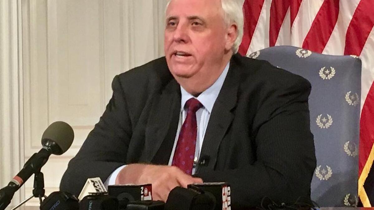 West Virginia Gov. Jim Justice addresses a news conference, Tuesday, Feb. 27, 2018, at the state Capitol in Charleston, W.Va. Justice announced that striking teachers would return to work on Thursday, and that he’s offering teachers and school service personnel a 5-percent pay increase in the first year.