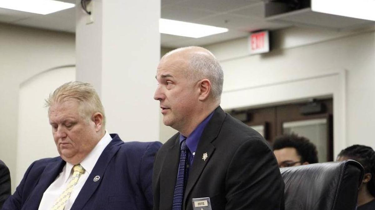 Shawn Helbig, a member of the board of the Kentucky Fraternal Order of Police, testified Feb. 8 in support of a bill that would make police officers, firefighters and EMS workers a protected class under Kentucky’s hate-crime law. Rep. Kevin Bratcher, R-Louisville, right, sponsored the bill.