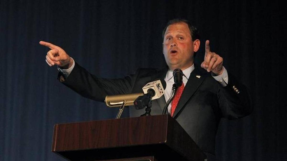 U.S. Rep. Andy Barr speaks to a large gathering at a Lexington town hall Monday night.