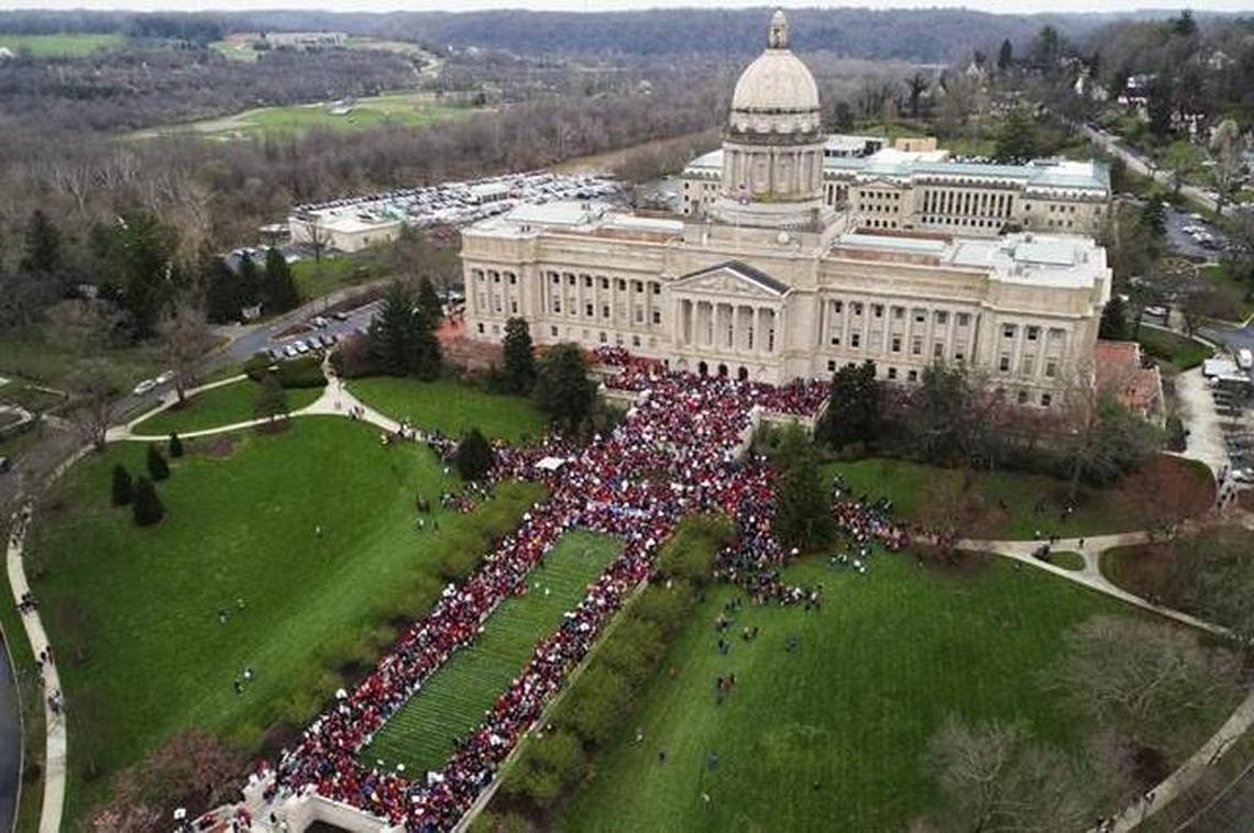 Thousands of teachers gather during a rally for education funding and changes to their pension system Monday, April 2, 2018, at the state Capitol in Frankfort.