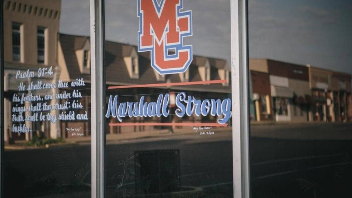 A Psalm and a message of solidarity on a downtown shop window was on display earlier this month in the wake of the shooting that killed two students at nearby Marshall County High School in Benton.