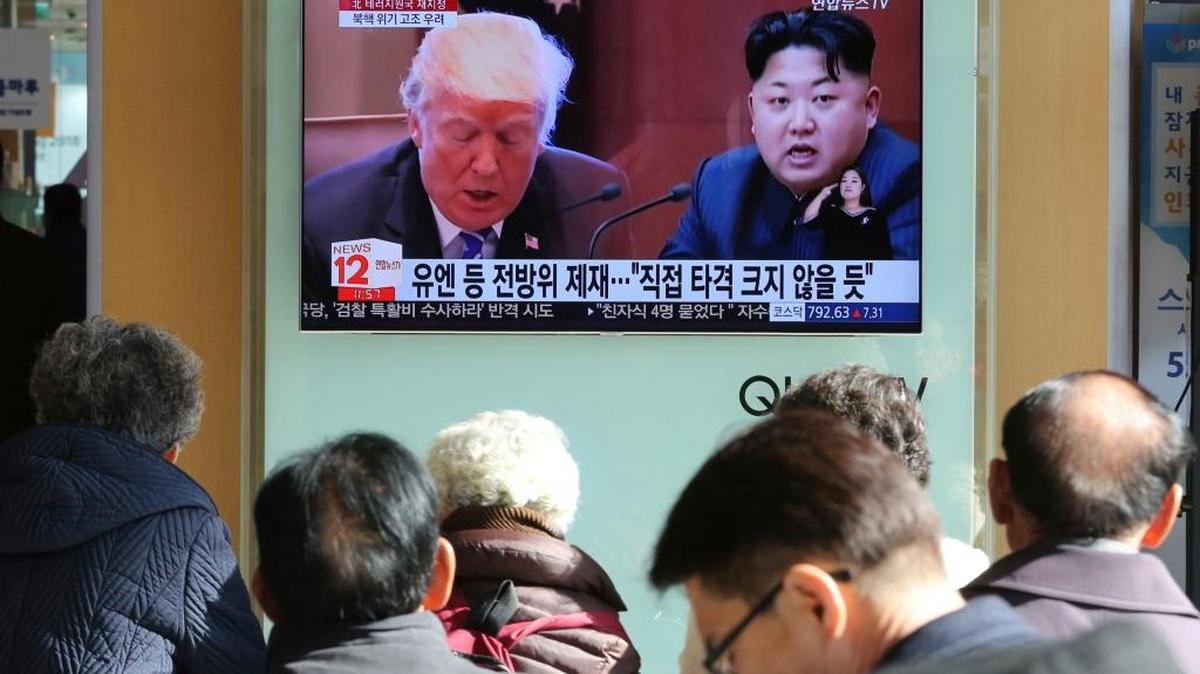 Last month, people watched a TV screen showing images of U.S. President Donald Trump, left, and North Korean leader Kim Jong Un at Seoul Railway Station in South Korea.