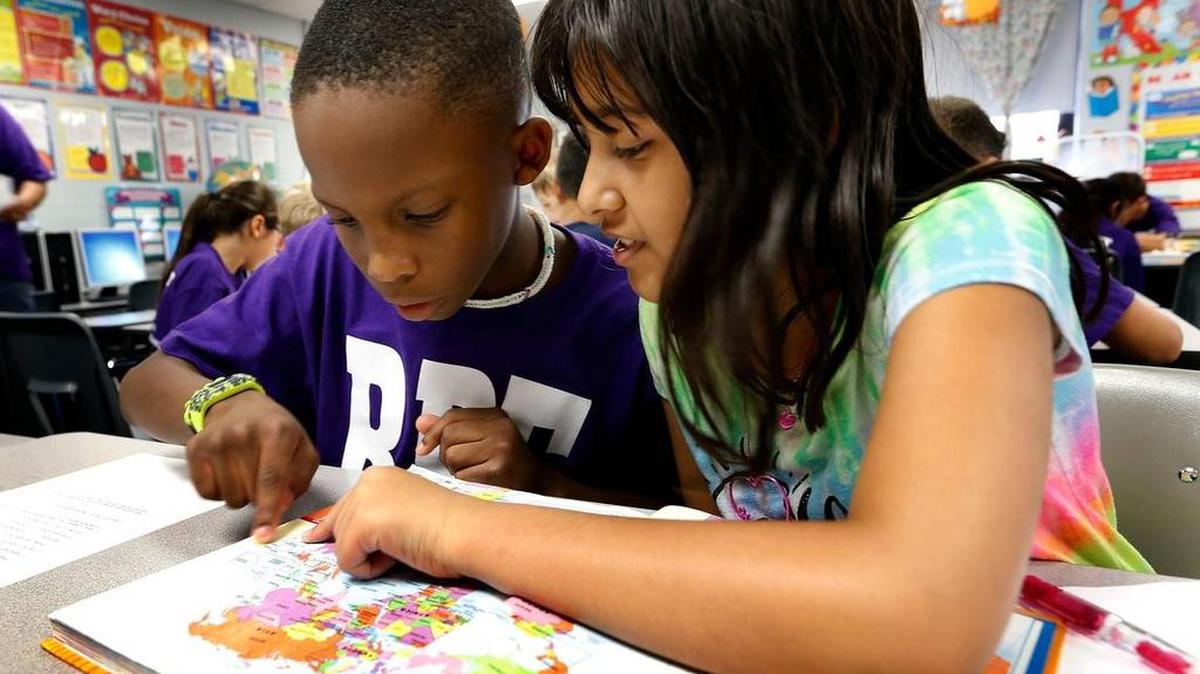 Rosa Parks Elementary School students Dillon Jenkins, left, and Eshaal Tatla, worked together in a fourth-grade social studies class in September. The Lexington school is one of the top 10 elementaries in the state in student performance in reading and math.