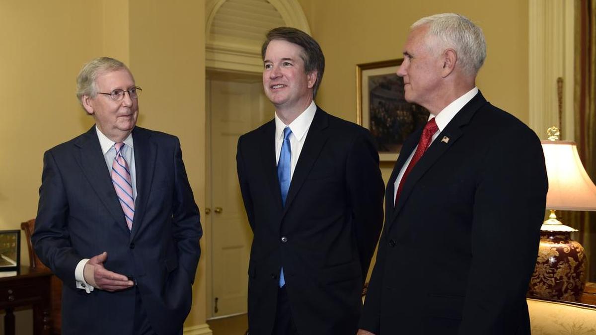 Senate Majority Leader Mitch McConnell, left, talked with Supreme Court nominee Brett Kavanaugh, center, as Vice President Mike Pence, right, listened during a July 2018 visit to Capitol Hill.