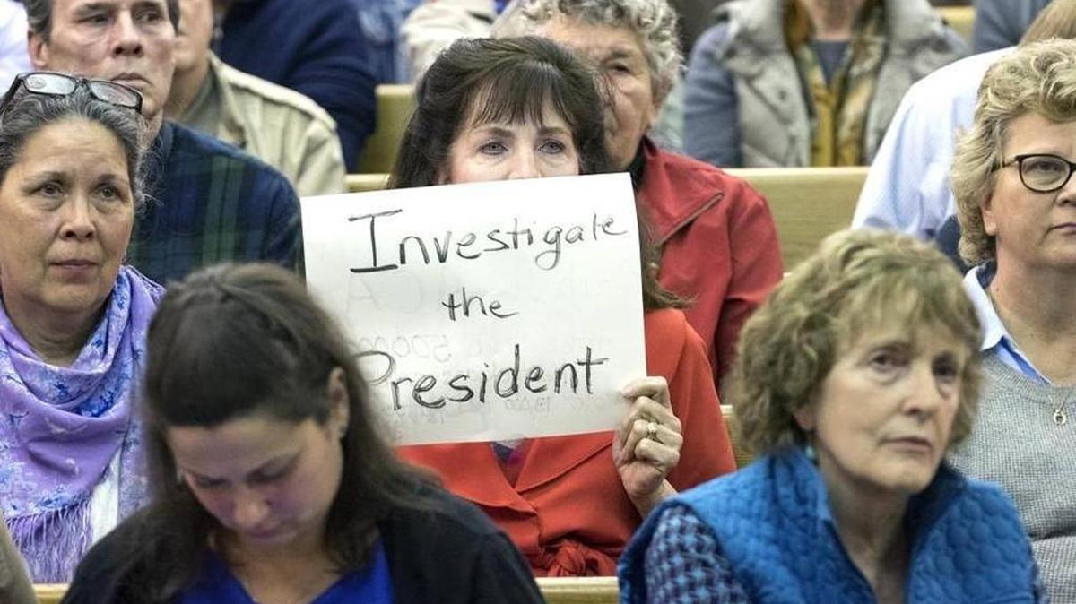 Carolyn Dupont, of Lexington, holds a sign for U.S. Rep. Andy Barr to see Wednesday, Feb. 22, 2017, during a forum at the Courthouse Annex in Mt. Sterling.