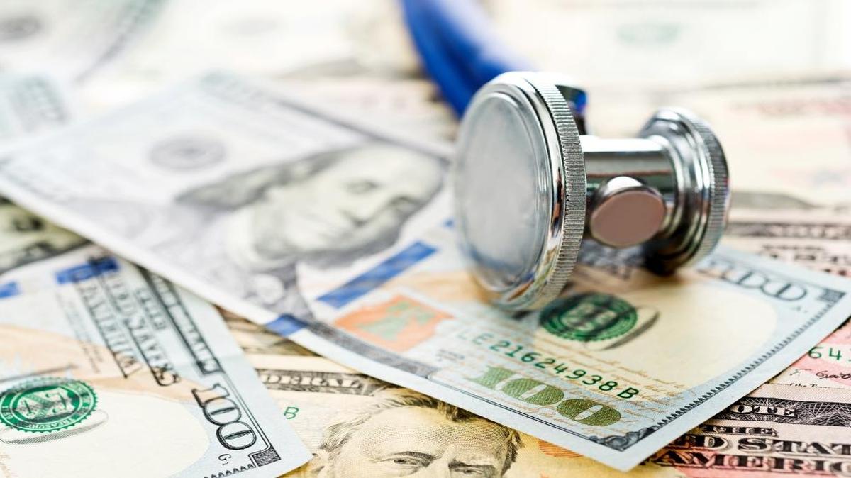 Stethoscope over the dollar bills.