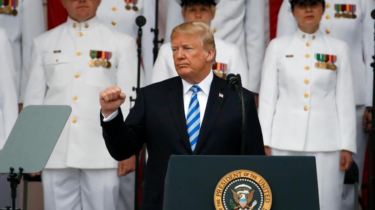 President Donald Trump gestures while speaking at the Memorial Amphitheater in Arlington National Cemetery on Memorial Day in 2018.