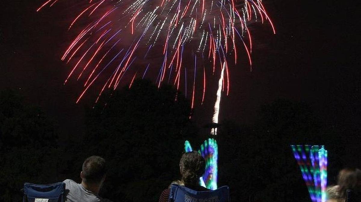 People watched Lexington’s fireworks display in the Commonwealth Stadium parking lot on July 4.
