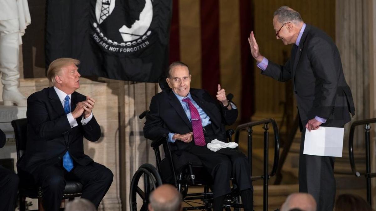 Former Senate Majority Leader Bob Dole, center, flanked by President Donald Trump, left, and Senate Minority Leader Chuck Schumer, D-N.Y., was honored at the Capitol with a Congressional Gold Medal on Jan. 17.