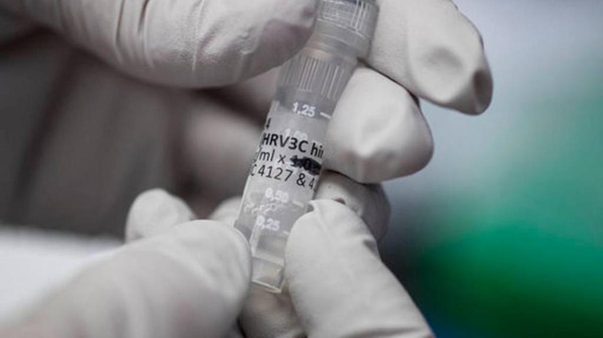 A biologist held a vial of flu-fighting antibodies at the Vaccine Research Center at the National Institutes of Health last month. Despite 100 years of science, the flu virus too often beats our best defenses because it constantly mutates.